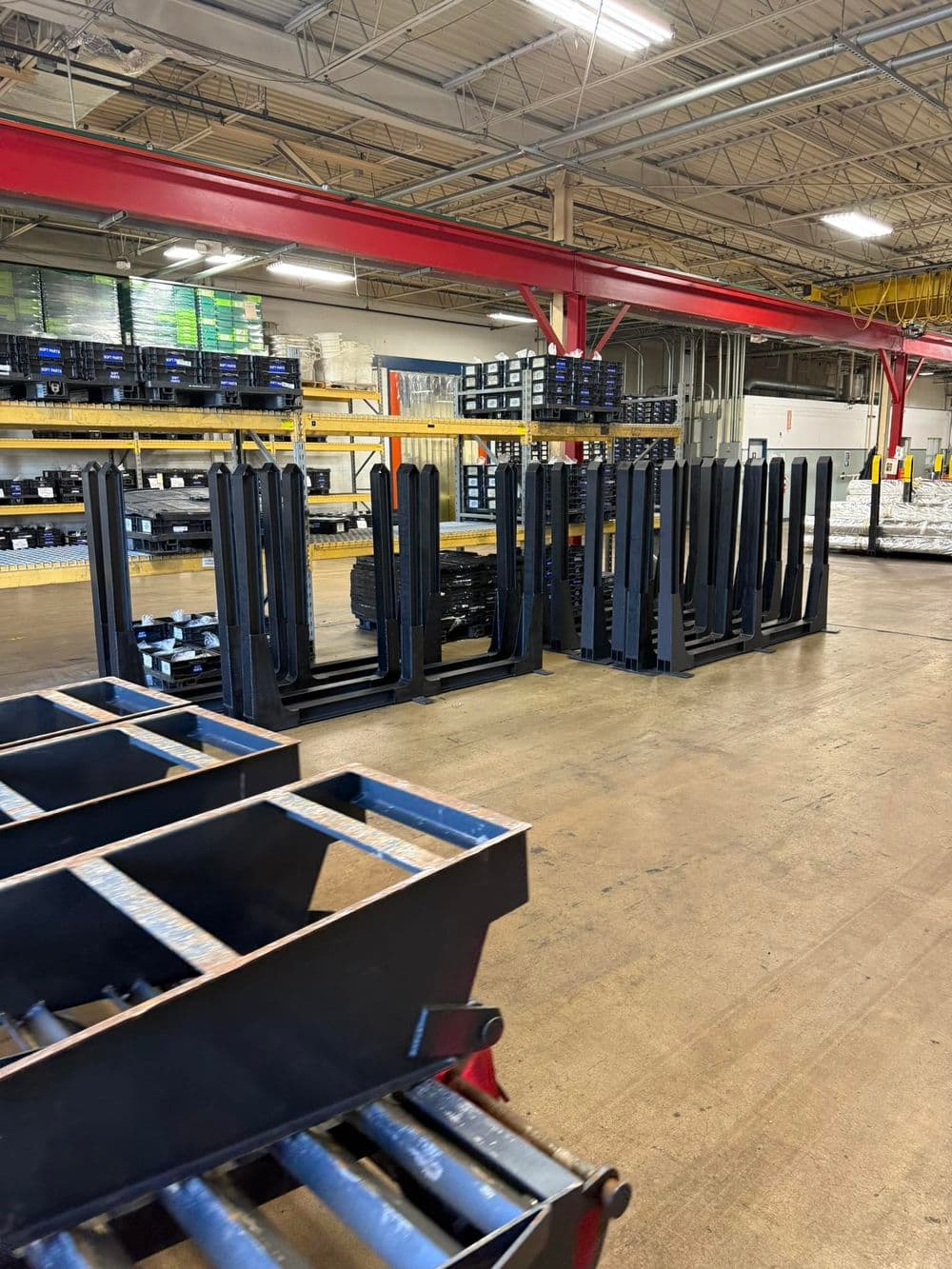 Metal storage racks and pallets inside a warehouse for inventory organization.